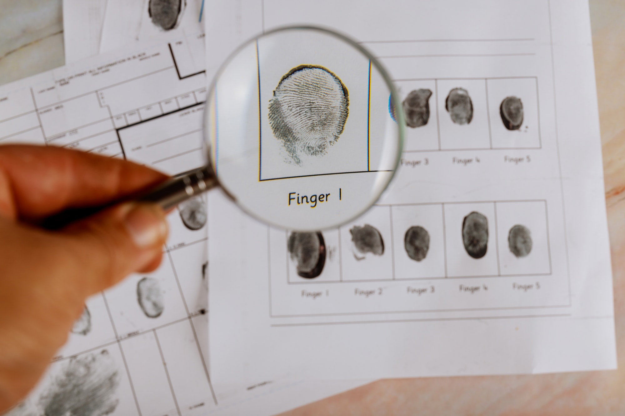 Criminal investigation, fingerprint card and magnifier arrest, accused, investigation